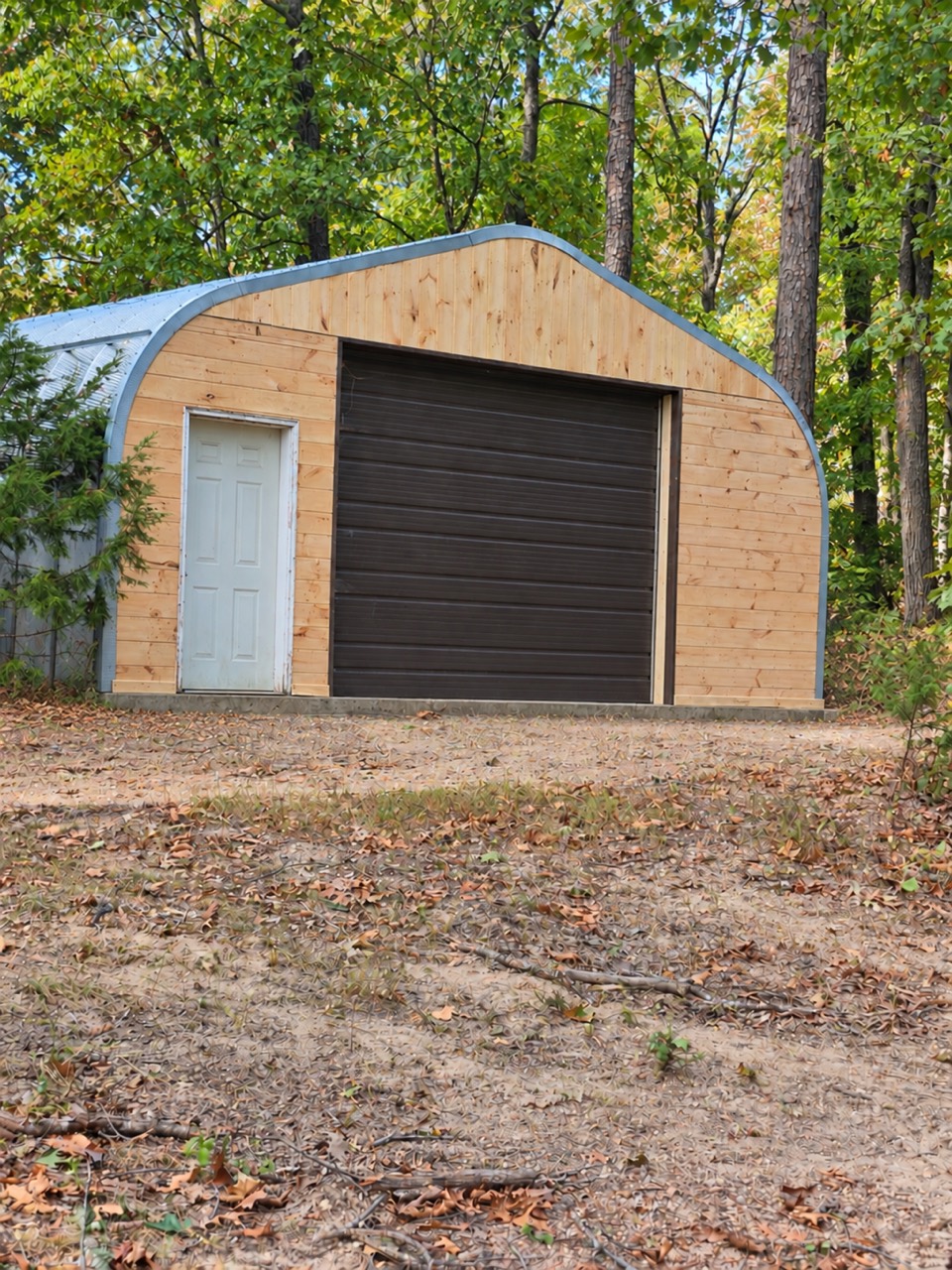 After: garage front with new wood siding